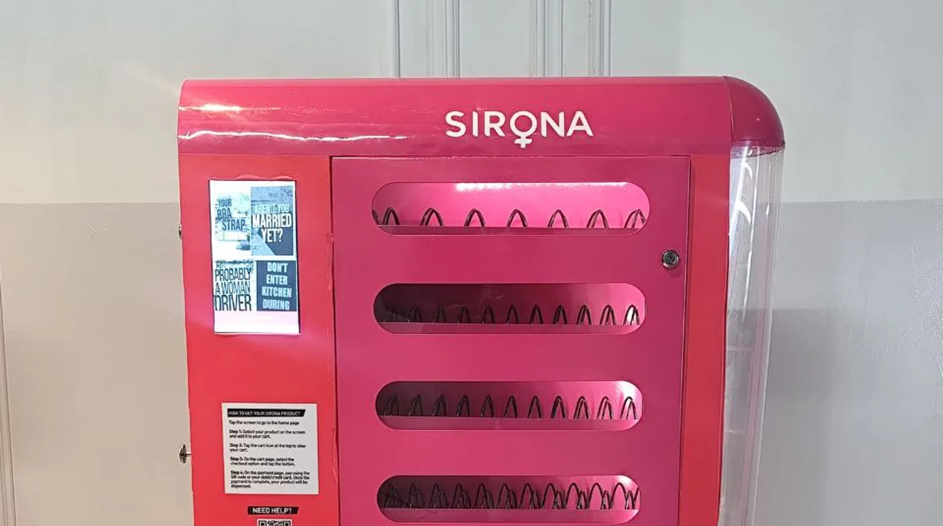 Vending machine payment panel showing a card reader, chip slot, NFC symbol and QR code