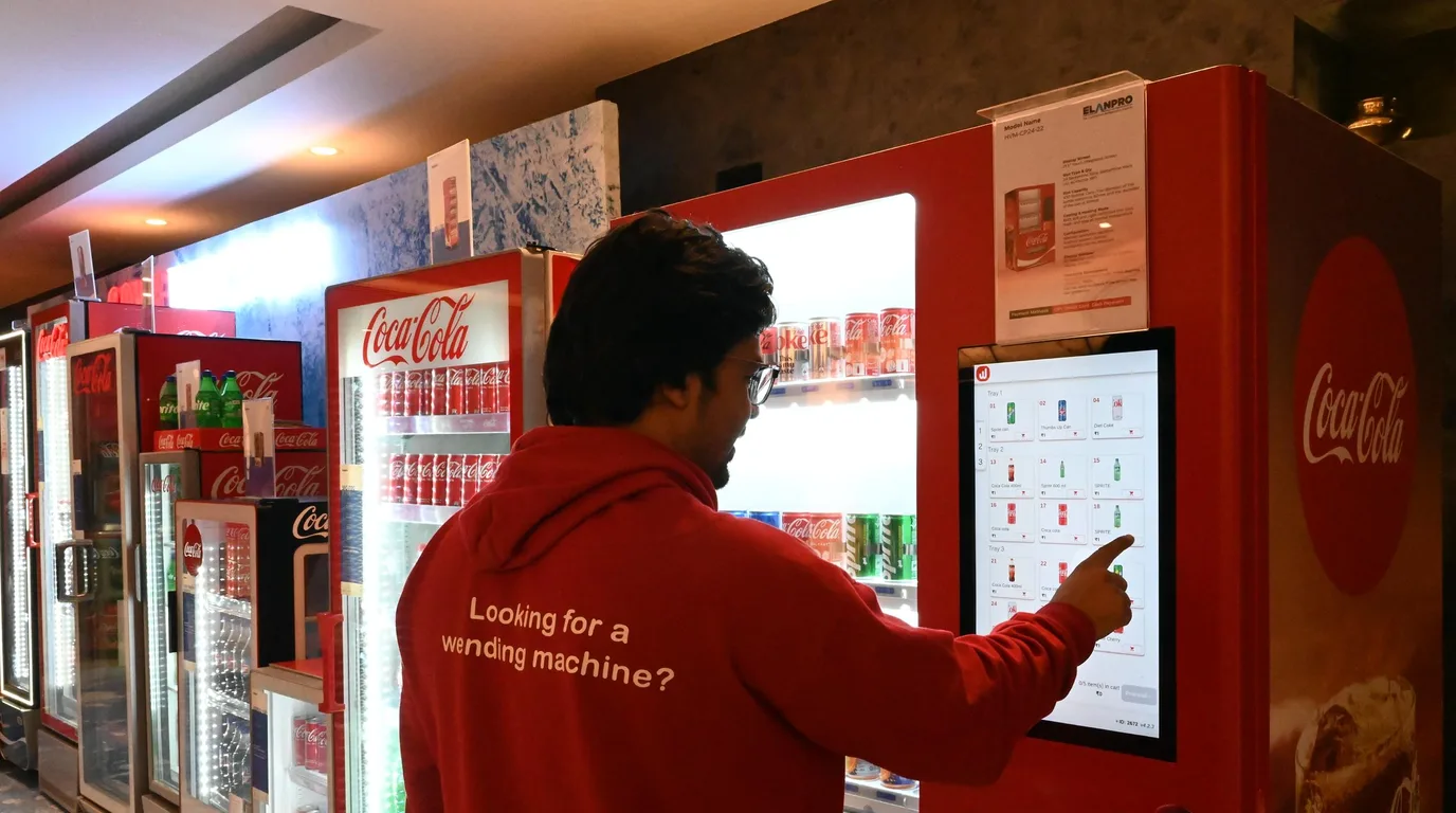 Premium refrigerated fresh-food vending machine with elevator mechanism on a studio backdrop