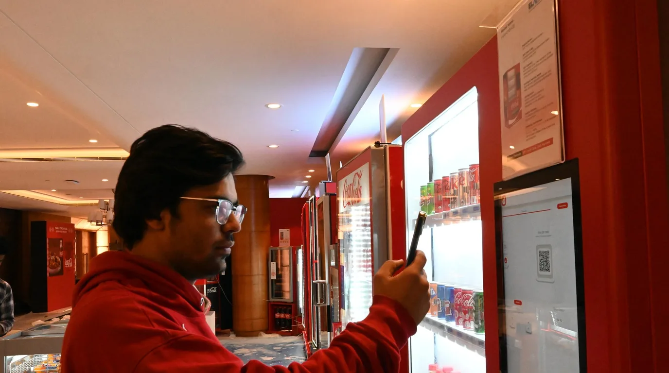Food-safety certificate with a seal beside a model vending machine and a snack