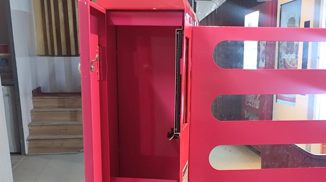Snack falling through a vending chute breaking an infrared drop sensor beam