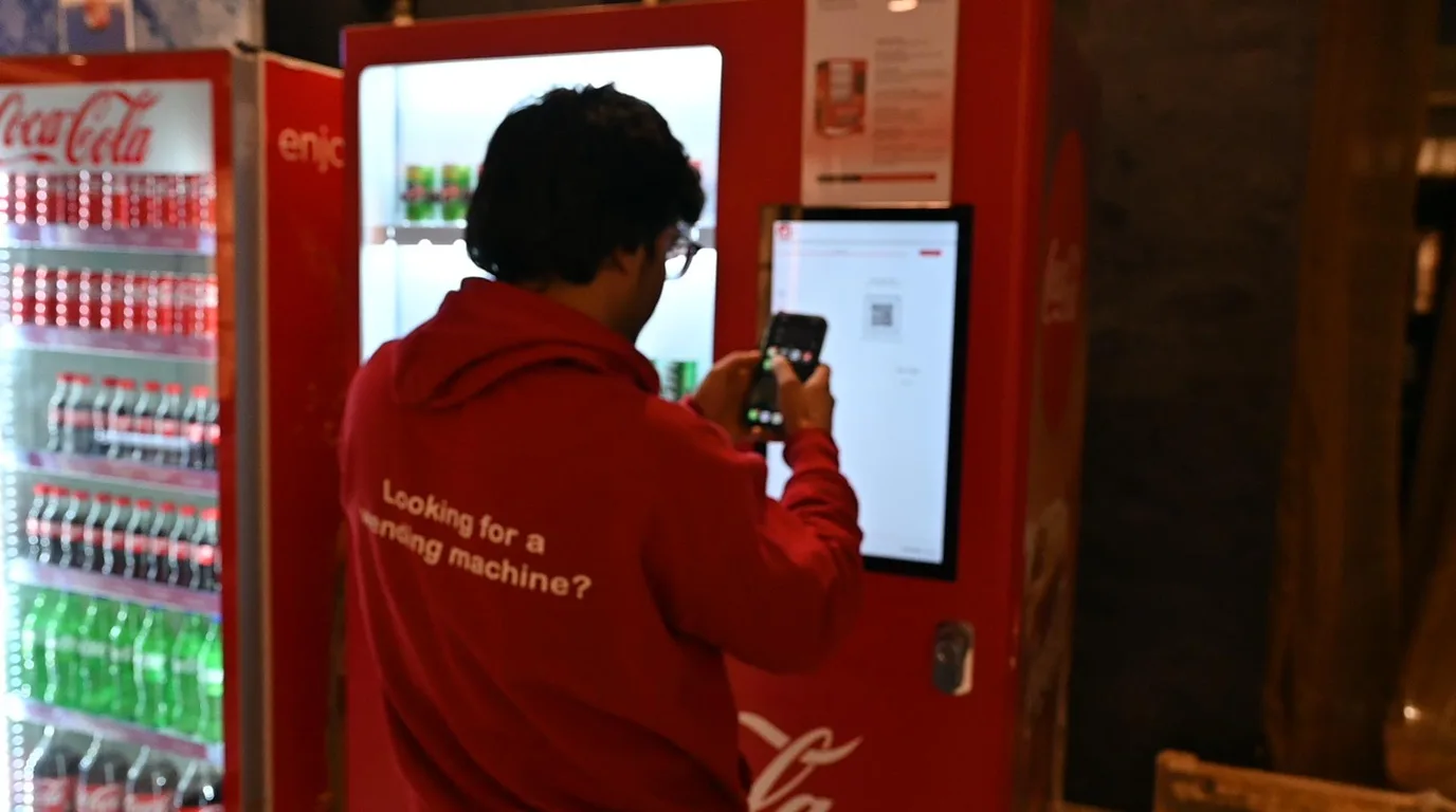 Split scene contrasting buying a vending machine outright with leasing it monthly
