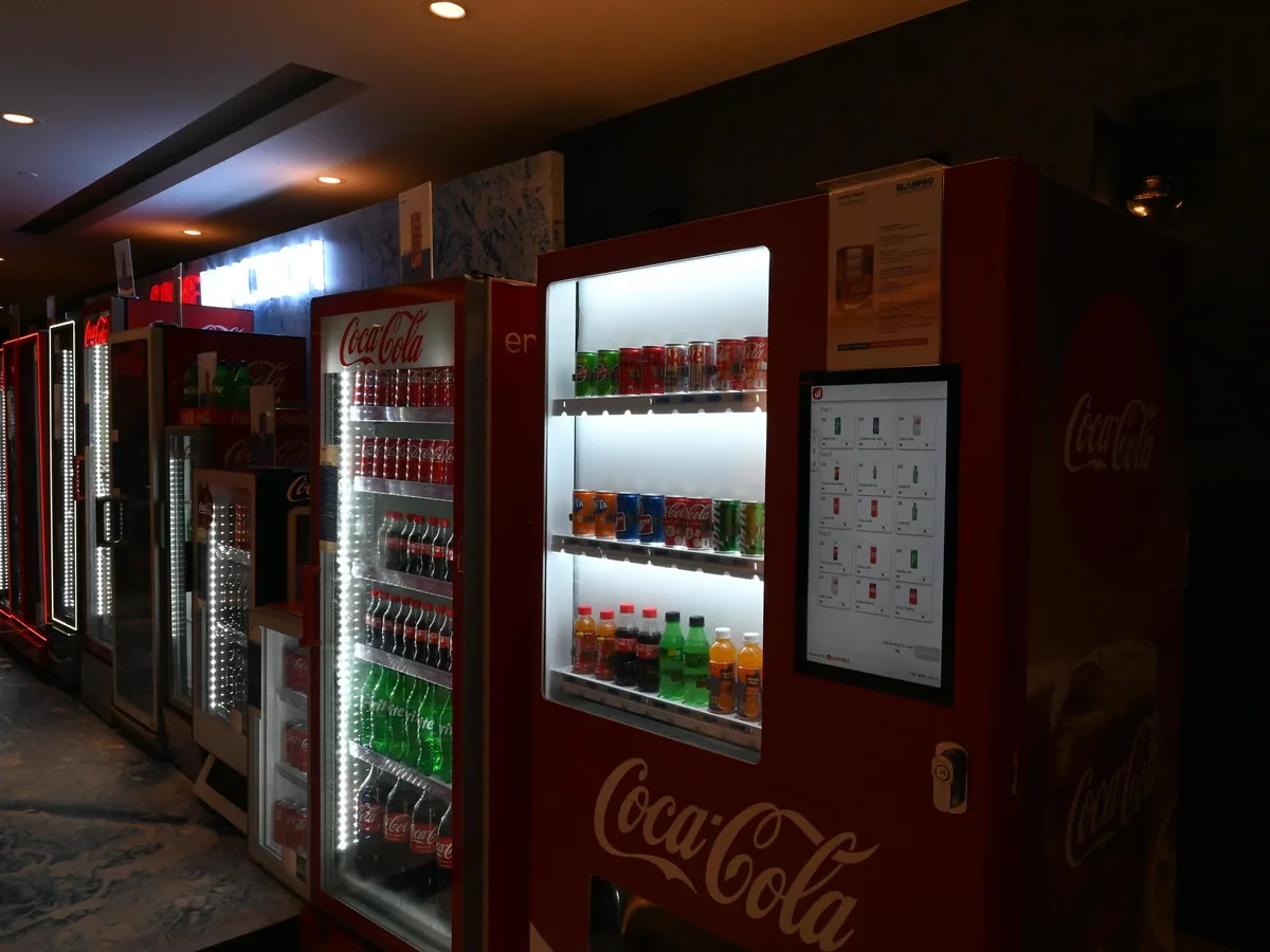 Organized spreadsheet of vending location prospects on a laptop beside a contact list.