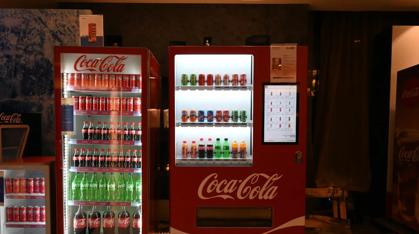 Busy workplace corridor with high footfall passing a spot suitable for a vending machine.
