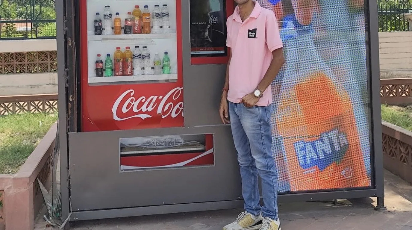 Secured vending machine with a camera and anchoring in a well-lit monitored location.