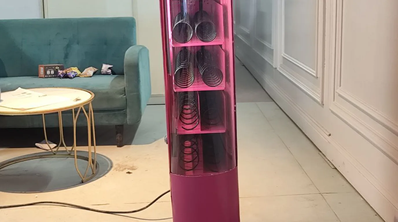 Hand flipping a vending machine power switch with a timer beside it