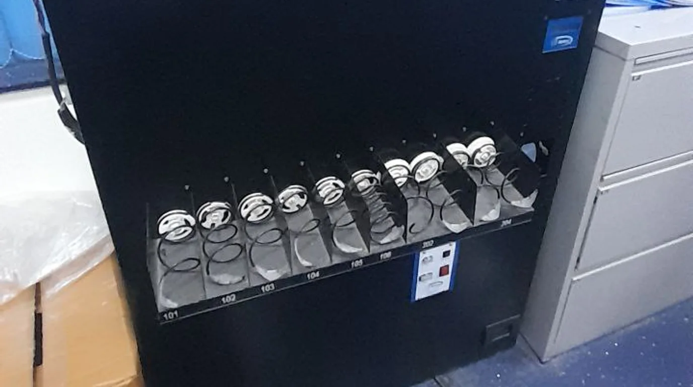 Overhead workspace showing vending market growth chart and a machine model