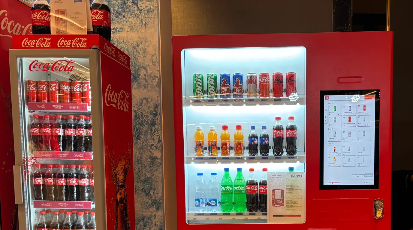 Customer making a cashless UPI payment at a modern vending machine