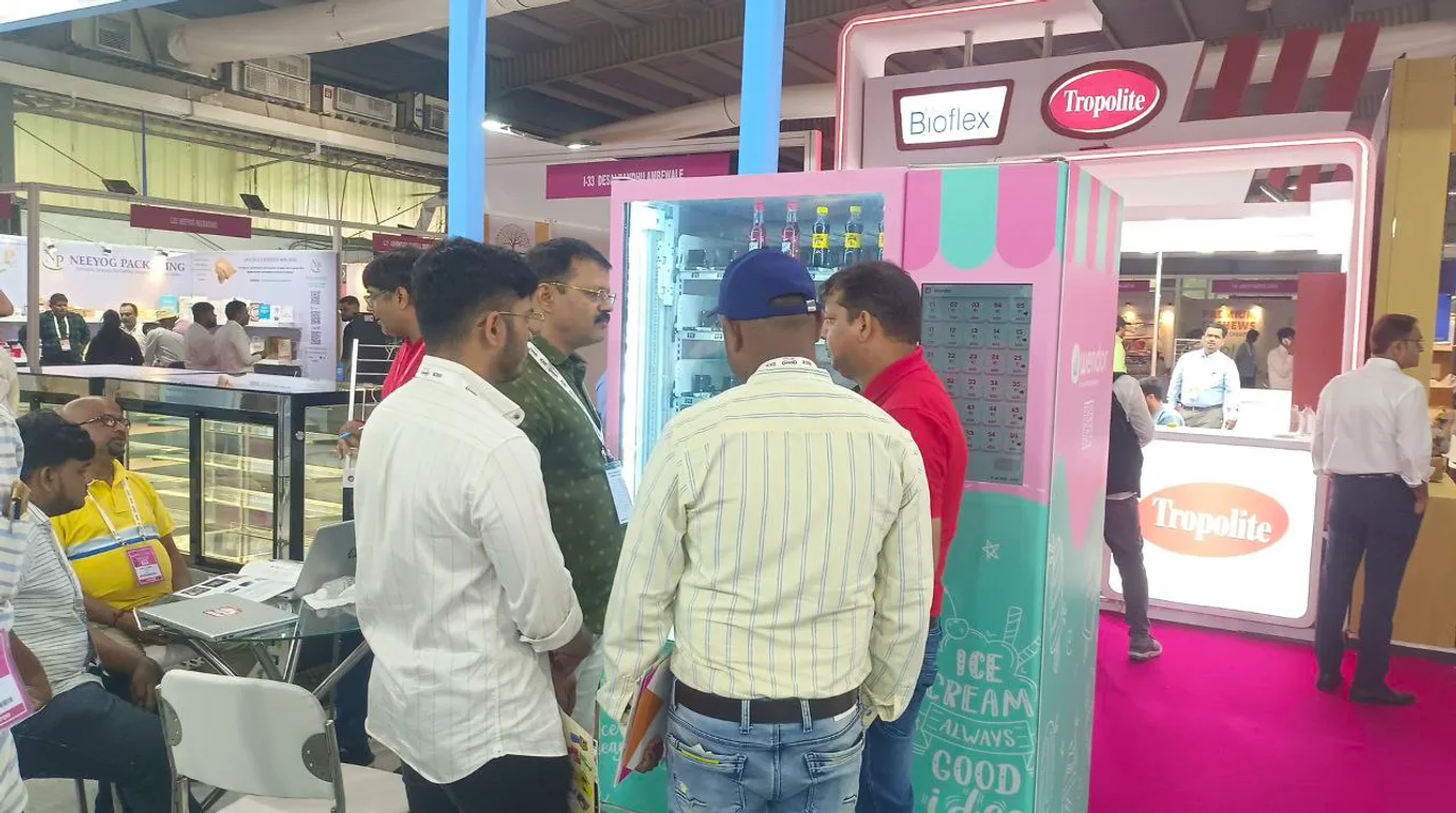 Overhead workspace with ice vending profit calculations and a revenue chart
