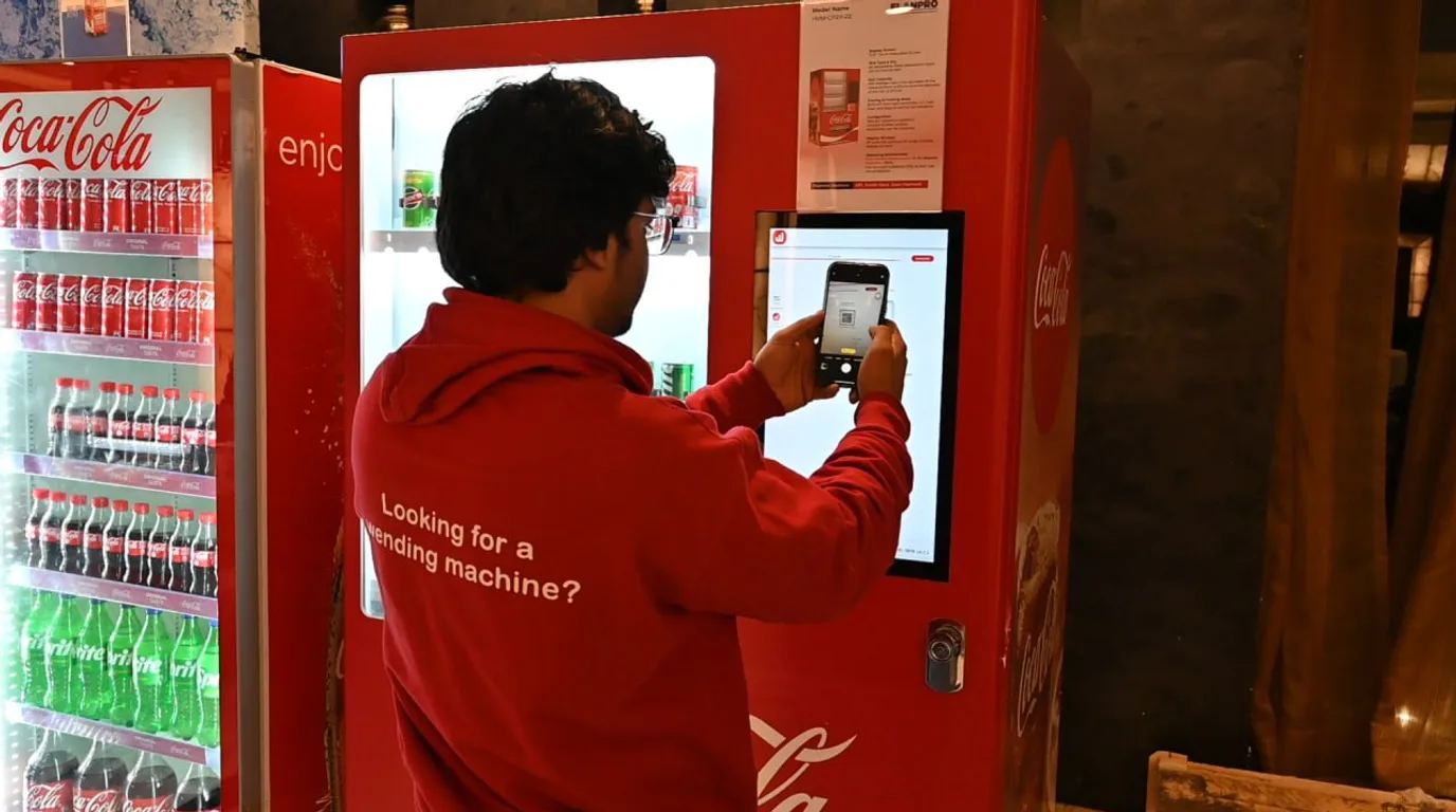 Neatly organized and curated vending machine interior through the glass