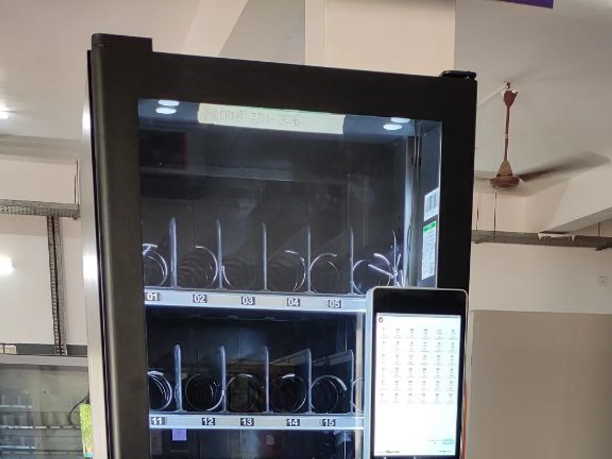 Close-up of a naloxone dispensing machine keypad and stocked product rows