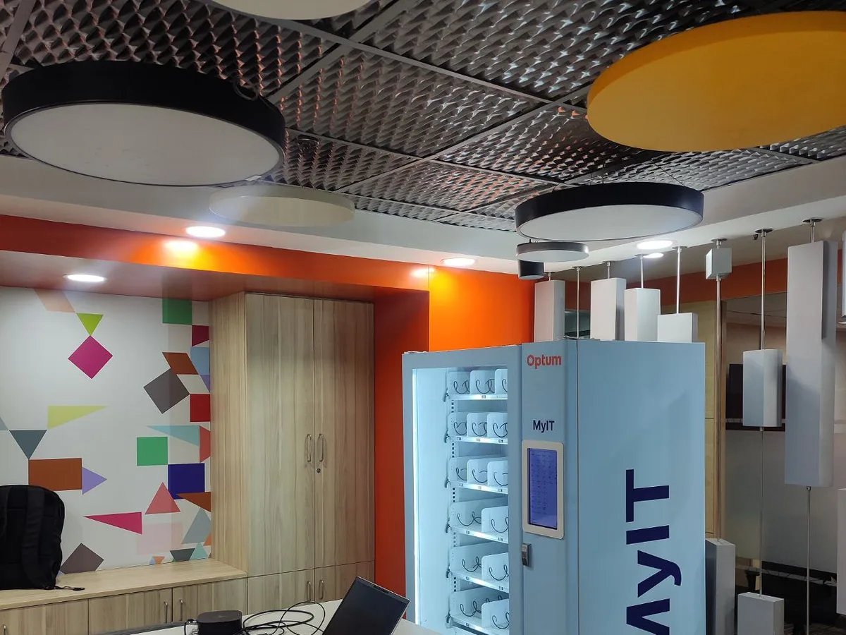 Brand-new smart vending machine with glowing touchscreen in a premium corporate lobby