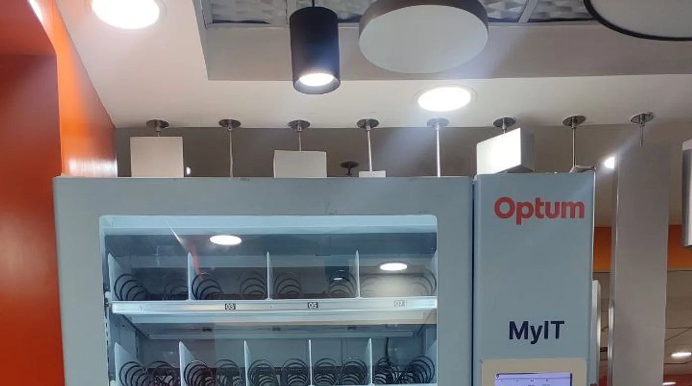 Three modern pizza vending machines lined up in a showroom comparison
