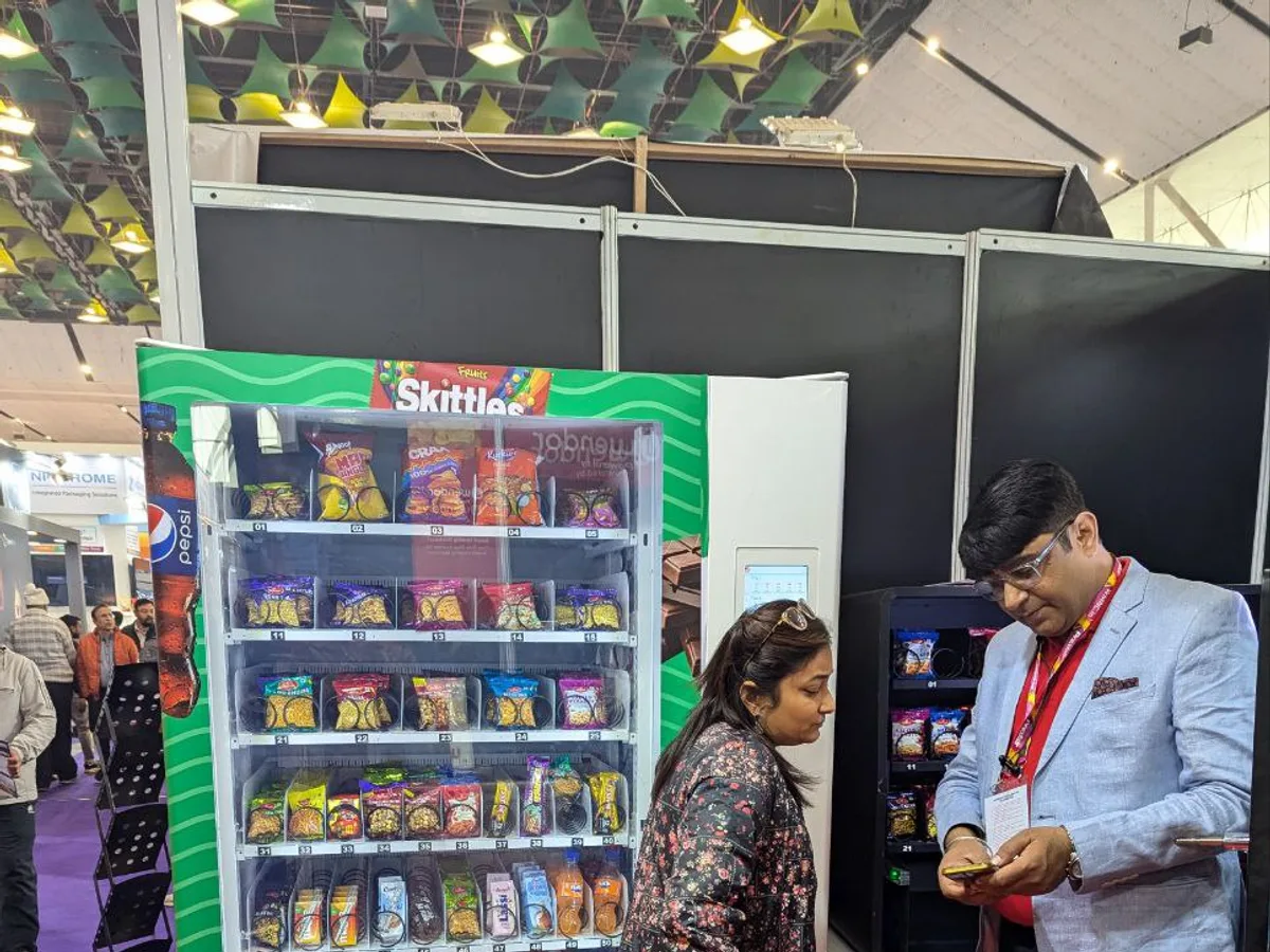 Inspector checking the temperature and hygiene of a pizza vending machine