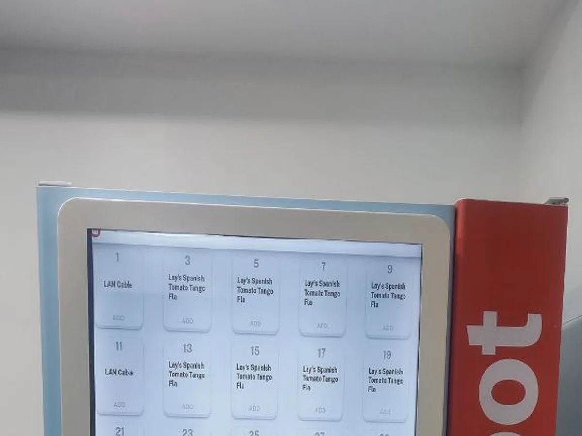 School administrator reviewing approved healthy items in a vending machine