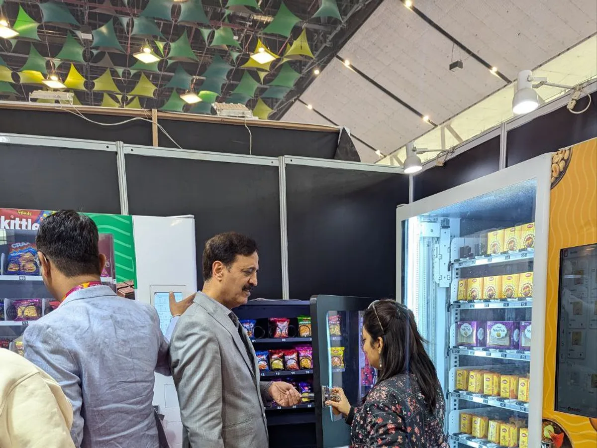 Sleek hair and beauty vending machine stocked with travel-size personal care items