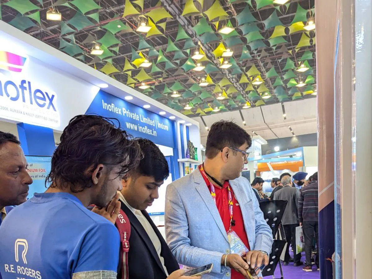 Modern self-service ticket vending kiosk with touchscreen in a transit concourse