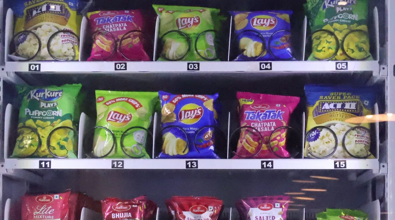 Operator selecting the right product mix for a vending machine on a desk