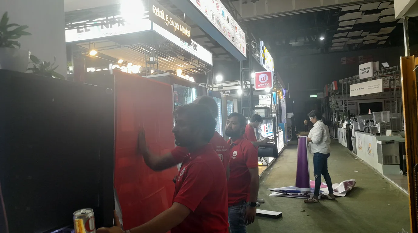 Inspector reviewing a clean refrigerated vending machine in Illinois