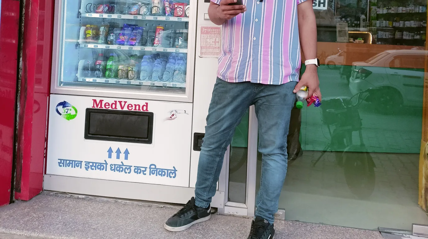 Row of modern Indian vending machines of different sizes in a clean showroom