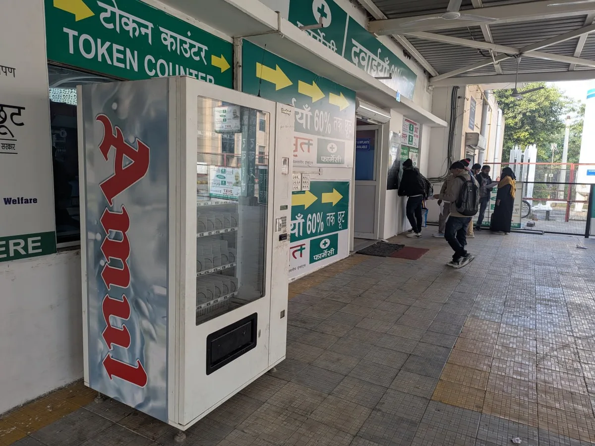 Handshake between franchisor and operator beside a branded vending machine