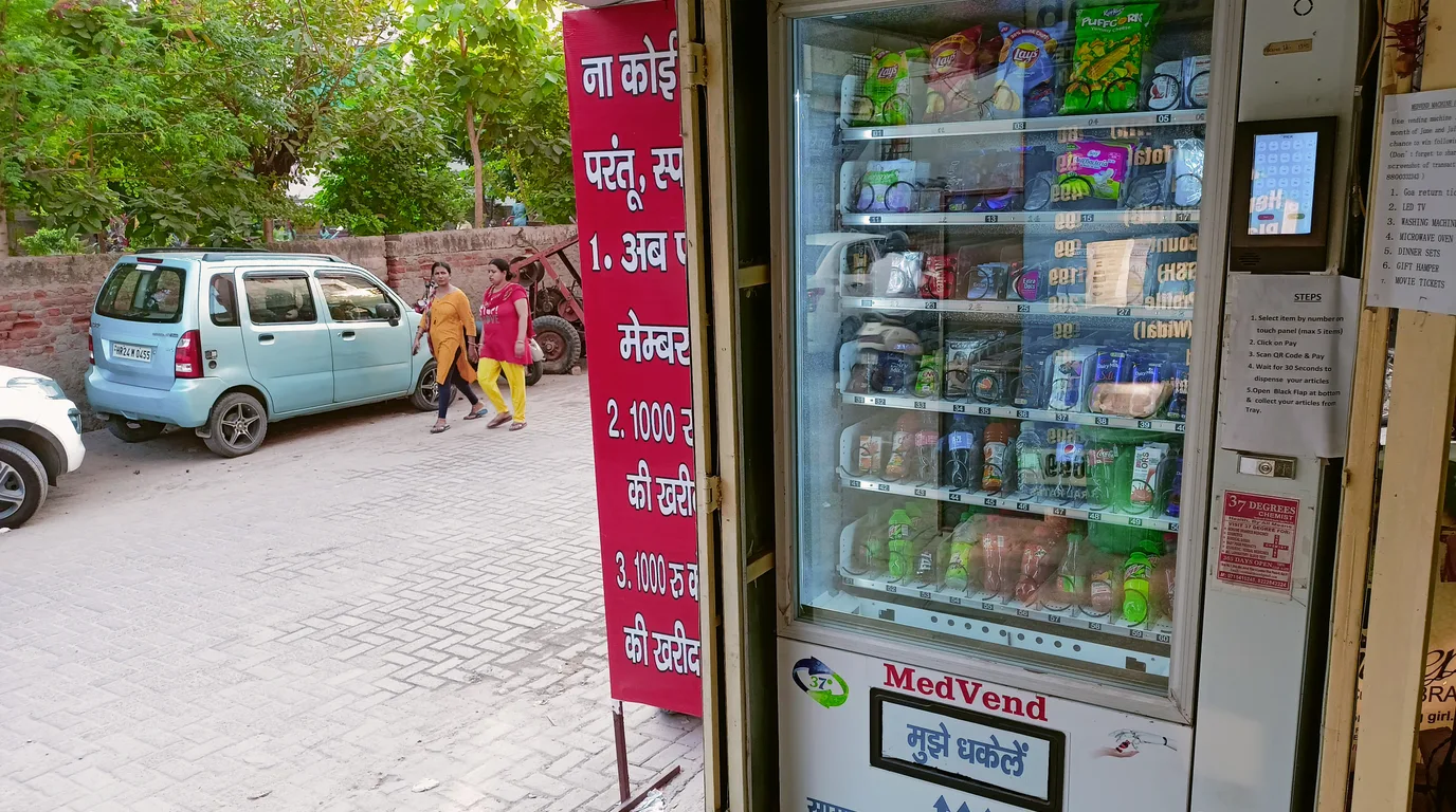 Showcase row of healthy-snack, coffee, and capsule-style vending machines