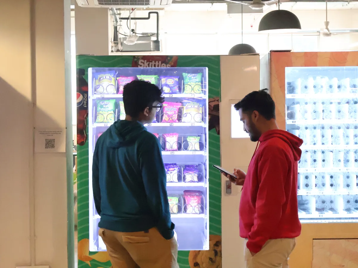 Flat-lay of three coverage concepts arranged around a vending machine model