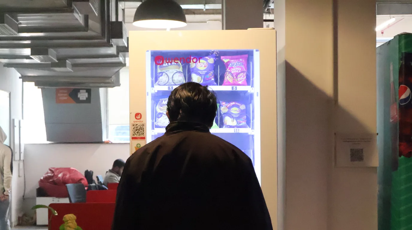 QR scan, RFID card, wallet app, and smartwatch tap at a vending machine panel