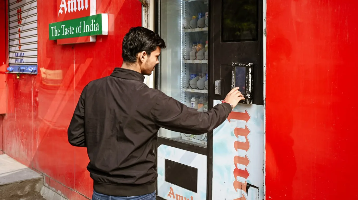 Row of snack, beverage, combo, fresh-food, and coffee vending machines