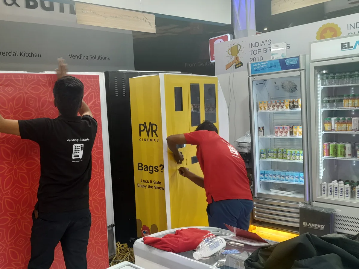 Indian customer paying by UPI QR code at a cashless vending machine