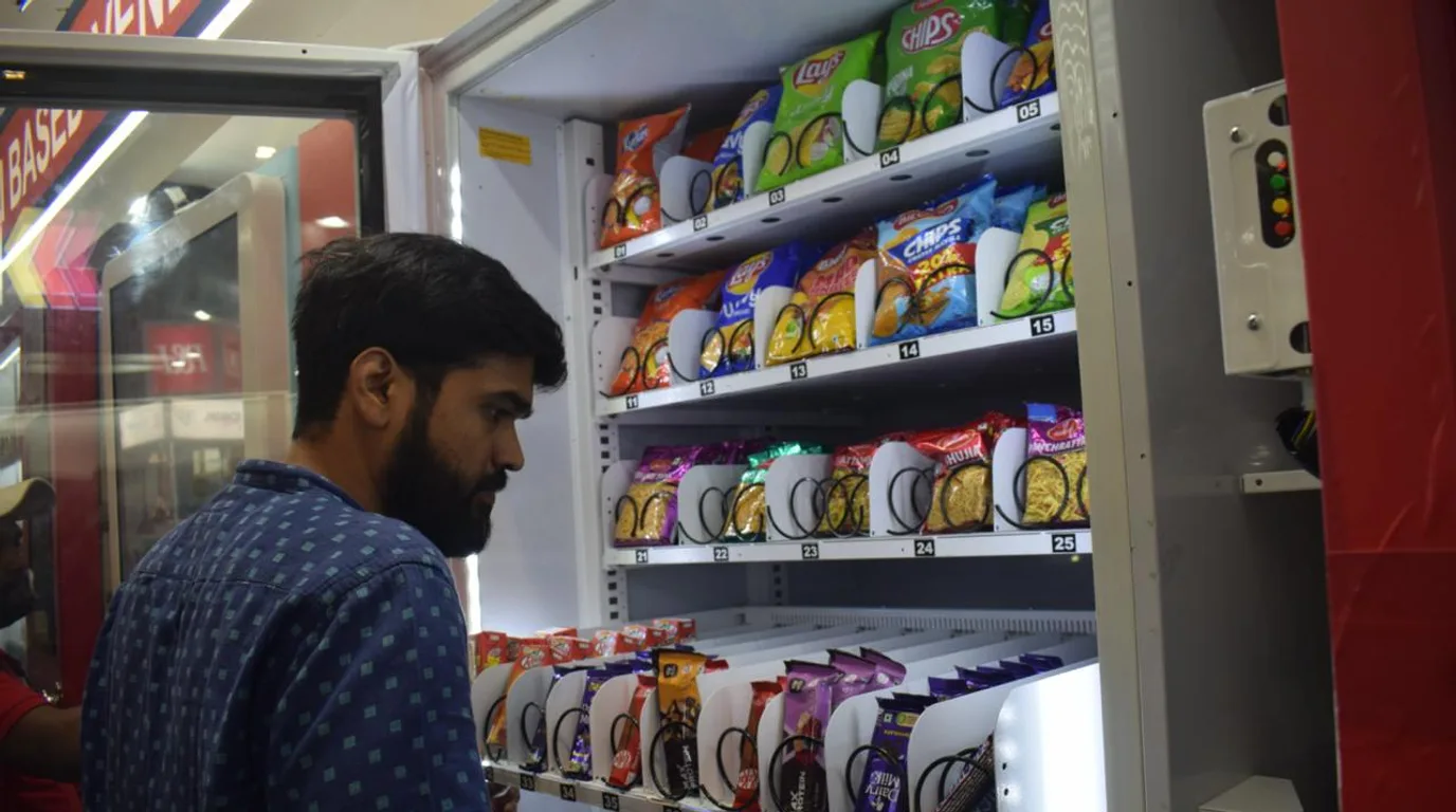 Japanese-style vending machine street compared with an adapted Indian vending machine