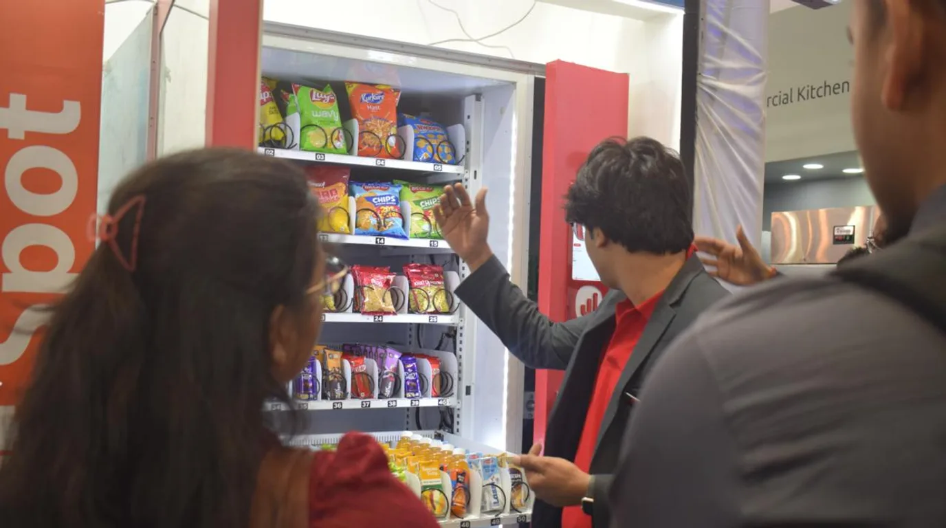 Vending operator actively working on a machine, showing it is a real business