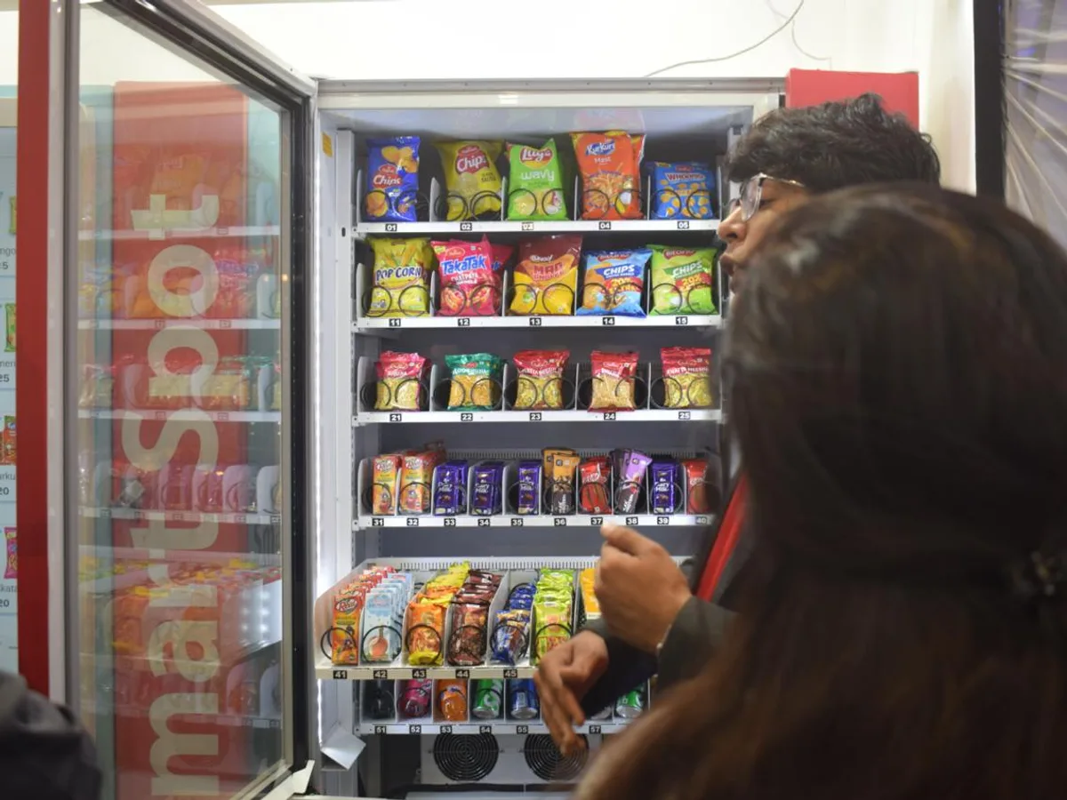 Operator calculating expenses and thin profit margins for a vending business